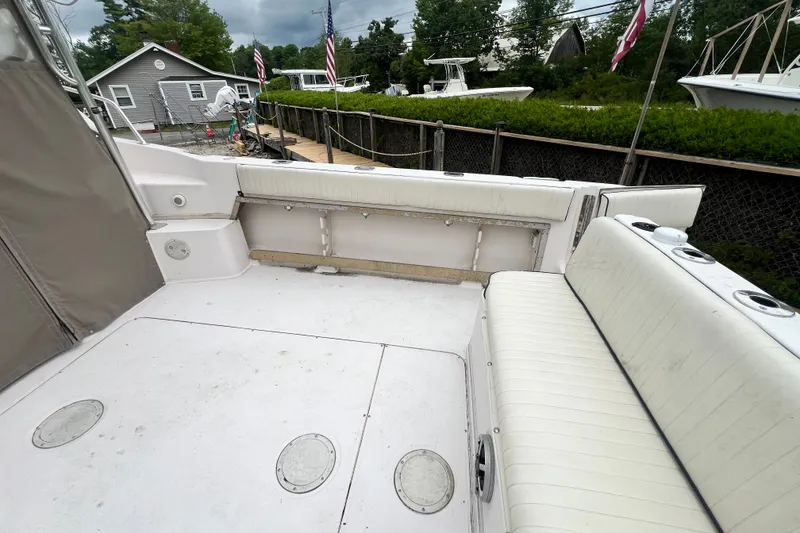 Slide: The Image of 1996 Grady-White Marlin 300 boat interior with white seating and deck. - 22