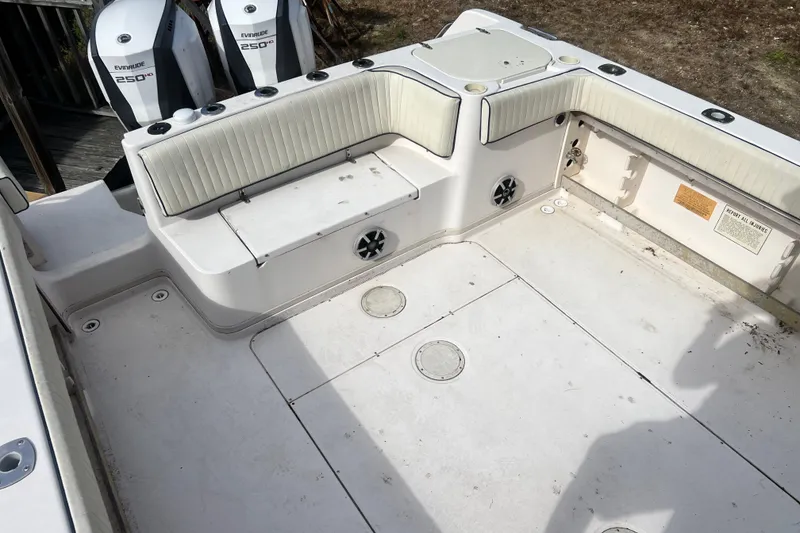 Slide: The Image of 1996 Grady-White Marlin 300 boat deck with seating and Evinrude engines. - 4