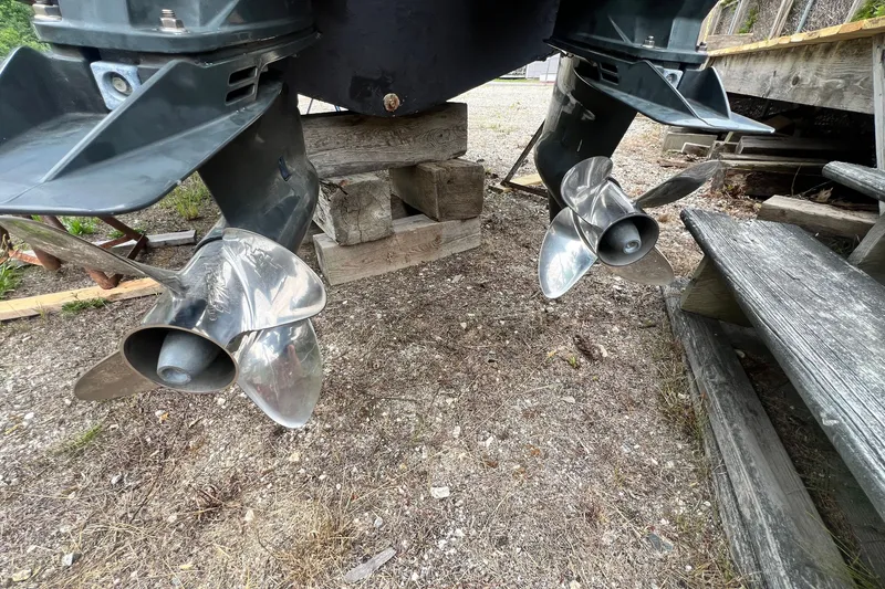 Slide: The Image of Twin propellers of a 1996 Grady-White Marlin 300 boat on dry land. - 25