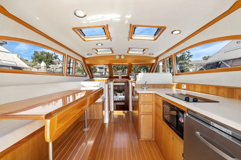 Slide: The Image of Luxurious interior of a 2009 Rivolta Coupe 4.5 yacht with wood finishes and modern amenities. - 35