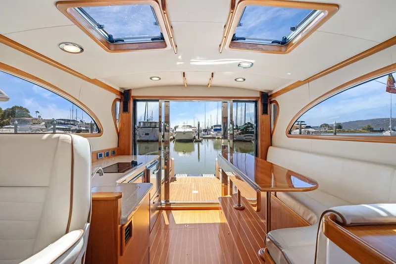 Slide: The Image of Luxurious interior of 2009 Rivolta Coupe 4.5 yacht with elegant wood finishes and marina view. - 44