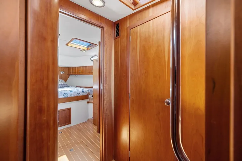 Slide: The Image of Interior of 2009 Rivolta Coupe 4.5, featuring wooden paneling and cozy cabin space. - 48