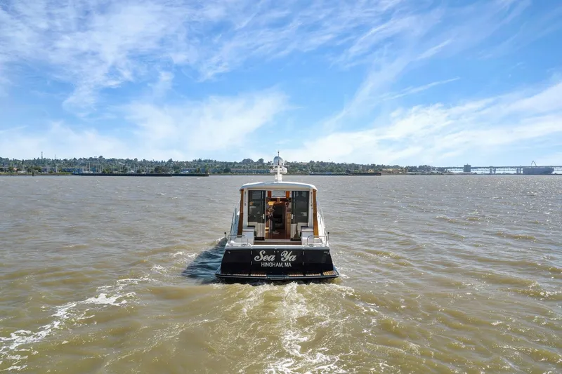 Slide: The Image of Boat named "Sea Ya" cruising on a sunny day, Rivolta Coupe 4.5, 2009 model. - 21