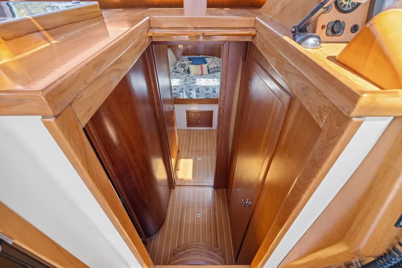 Slide: The Image of Interior view of 2009 Rivolta Coupe 4.5, featuring polished wooden finishes and cozy cabin space. - 45