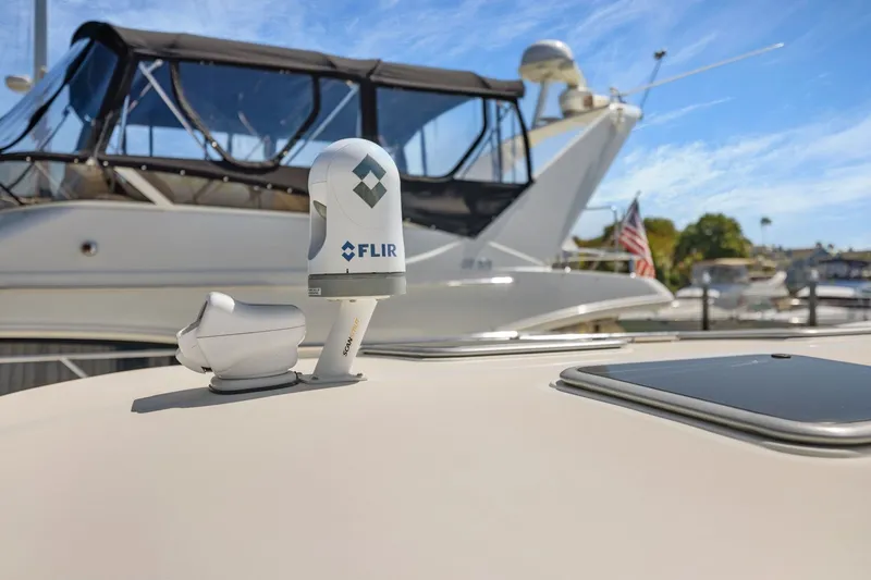 Slide: The Image of FLIR camera on 2009 Rivolta Coupe 4.5 yacht, docked with clear blue sky. - 57