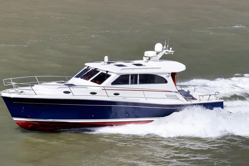 The Image of 2009 Rivolta Coupe 4.5 yacht cruising on open water. - 0
