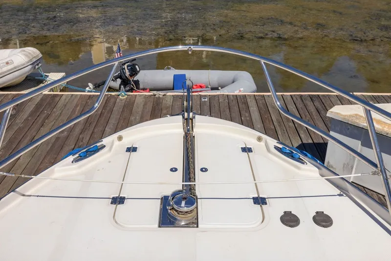Slide: The Image of Bow of 2009 Rivolta Coupe 4.5 yacht docked at a wooden pier. - 60