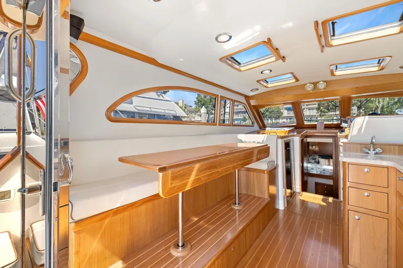 Slide: The Image of Luxurious 2009 Rivolta Coupe 4.5 yacht interior with wood finishes and ample natural light. - 37
