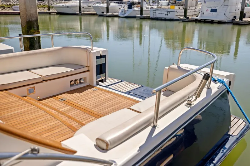 Slide: The Image of Luxury Rivolta Coupe 4.5 yacht, 2009 model, docked at marina with elegant seating. - 30