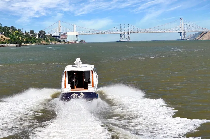 Slide: The Image of Boat cruising under a bridge on a sunny day, Rivolta Coupe 4.5, 2009. - 14