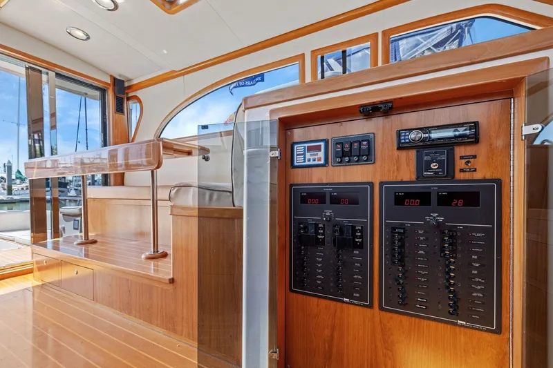 Slide: The Image of Interior of 2009 Rivolta Coupe 4.5 showcasing wooden paneling and control systems. - 43