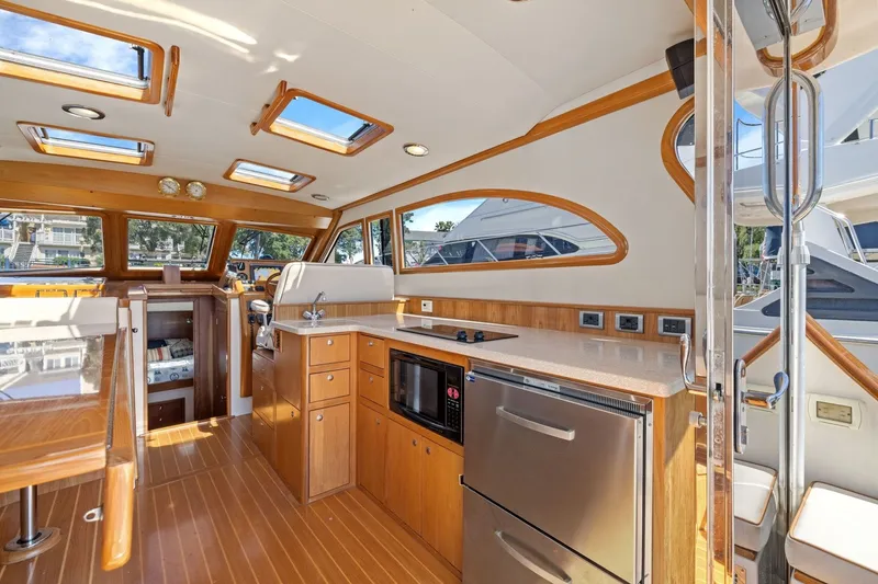 Slide: The Image of Luxurious 2009 Rivolta Coupe 4.5 yacht interior with modern kitchen and wooden finishes. - 36