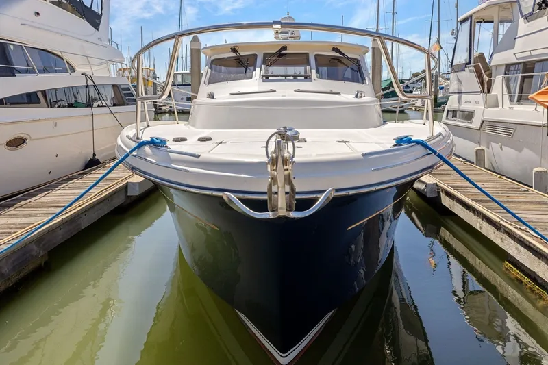 Slide: The Image of Front view of a 2009 Rivolta Coupe 4.5 yacht docked at a marina. - 62