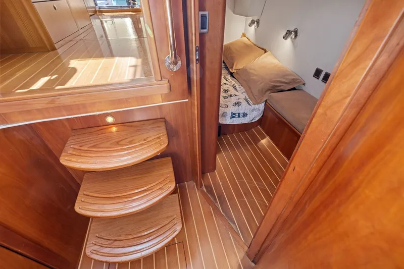 Slide: The Image of Luxurious wooden interior of 2009 Rivolta Coupe 4.5, featuring cozy cabin and elegant steps. - 46