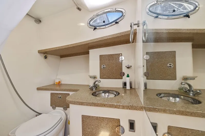 Slide: The Image of Luxurious bathroom in 2009 Rivolta Coupe 4.5 with modern fixtures and porthole window. - 55