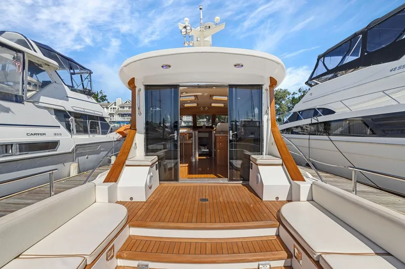 Slide: The Image of 2009 Rivolta Coupe 4.5 yacht with elegant wooden deck and luxurious interior. - 32