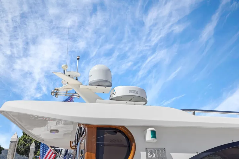 Slide: The Image of Luxury yacht with radar equipment against a clear blue sky. - 63