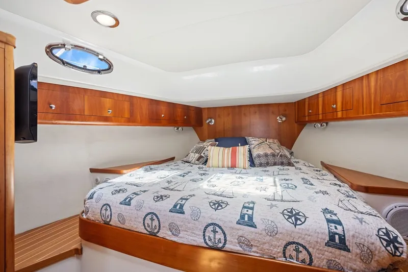 Slide: The Image of Luxurious cabin interior of 2009 Rivolta Coupe 4.5 with nautical-themed bedding. - 51