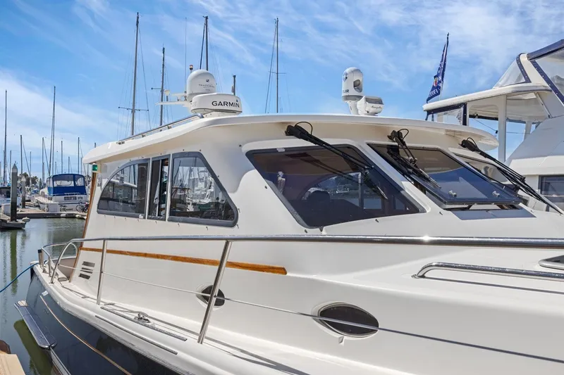 Slide: The Image of 2009 Rivolta Coupe 4.5 yacht docked at marina with clear blue sky. - 64