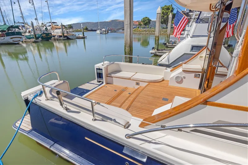 Slide: The Image of Luxury 2009 Rivolta Coupe 4.5 yacht docked in a serene marina setting. - 28