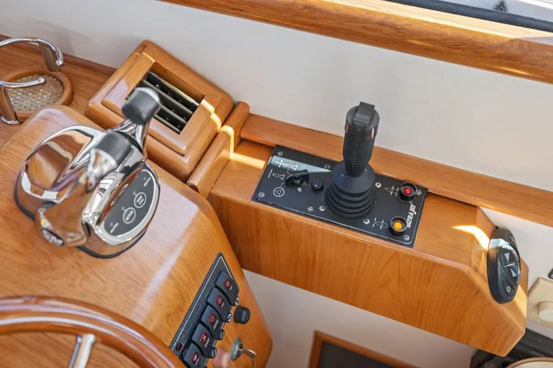 Slide: The Image of 2009 Rivolta Coupe 4.5 interior controls with joystick and polished wood finish. - 42