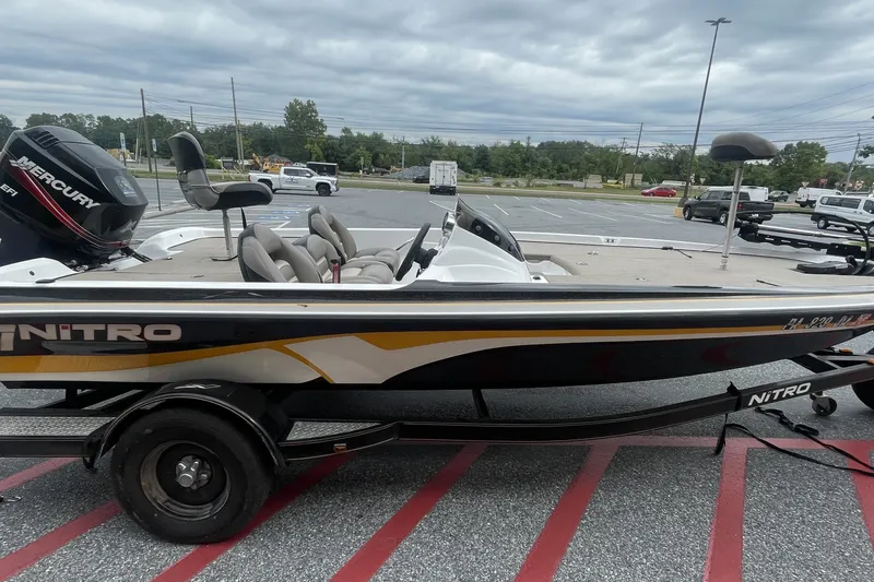 The Image of 2008 Nitro Z-7 boat with Mercury engine in parking lot, overcast sky. - 0
