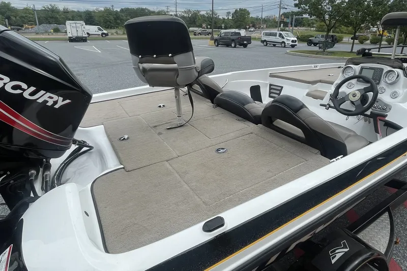 Slide: The Image of 2008 Nitro Z-7 boat interior with Mercury engine, featuring seating and steering console. - 5
