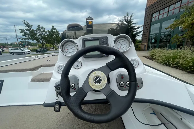 Slide: The Image of Steering console of a 2008 Nitro Z-7 boat with gauges and controls. - 6