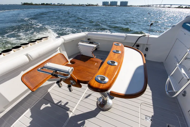 Slide: The Image of Fishing deck of 1998 Hatteras 60 Convertible yacht with rod holders and ocean view. - 24