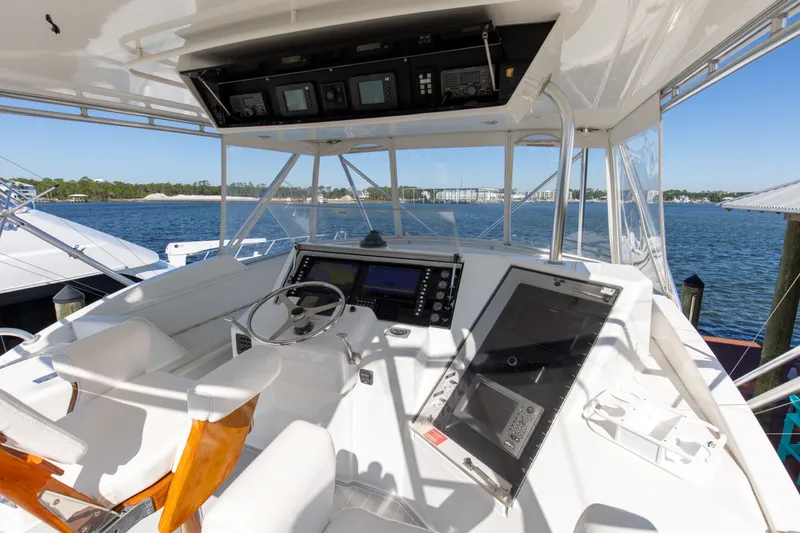 Slide: The Image of Cockpit of 1998 Hatteras 60 Convertible yacht with steering wheel and navigation equipment. - 30