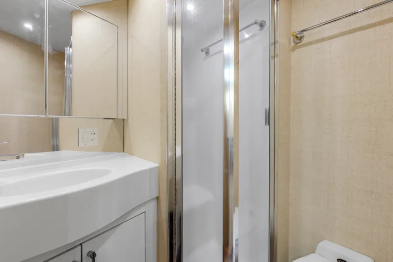 Slide: The Image of Bathroom interior of 1998 Hatteras 60 Convertible yacht with modern fixtures and shower. - 22
