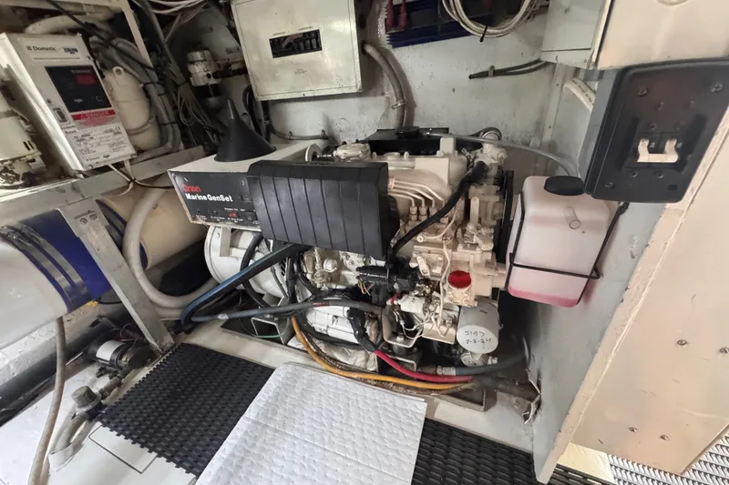 Slide: The Image of Engine room of a 1998 Hatteras 60 Convertible yacht with Onan Marine GenSet. - 38