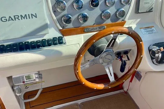 Slide: The Image of Steering wheel and dashboard of 2013 Chris-Craft Corsair 32 boat with Garmin equipment. - 8