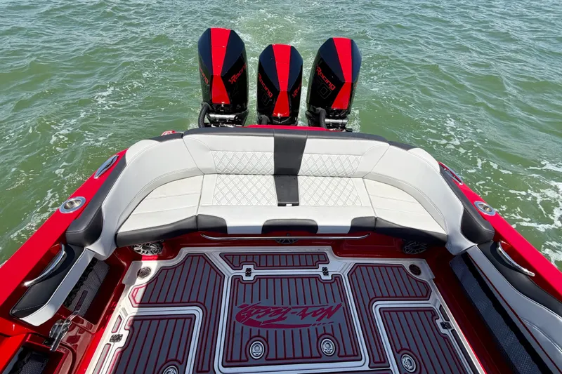 Slide: The Image of 2022 Nor-Tech 390 Sport boat with triple engines and luxurious seating on the water. - 45