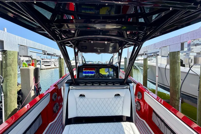 Slide: The Image of 2022 Nor-Tech 390 Sport boat interior with advanced navigation system at marina. - 50