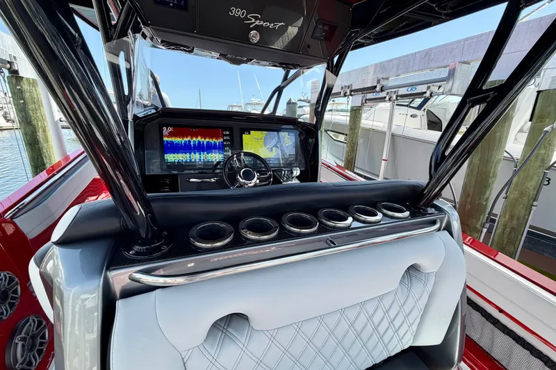 Slide: The Image of 2022 Nor-Tech 390 Sport boat dashboard with advanced navigation and control systems. - 51
