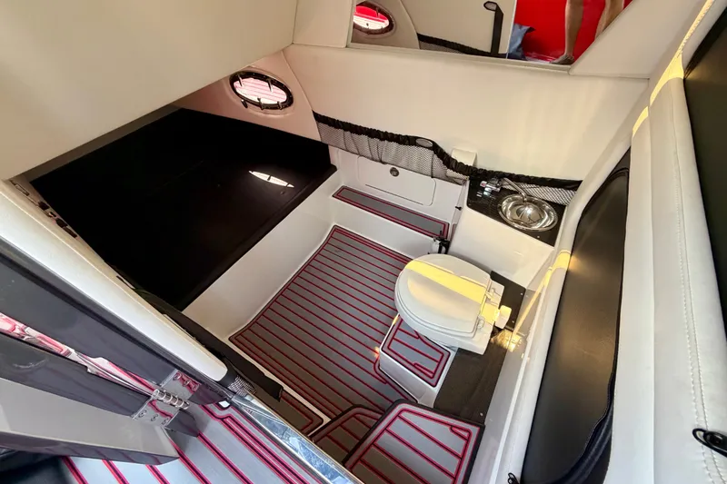 Slide: The Image of 2022 Nor-Tech 390 Sport cabin interior with toilet and sink, featuring modern design. - 59