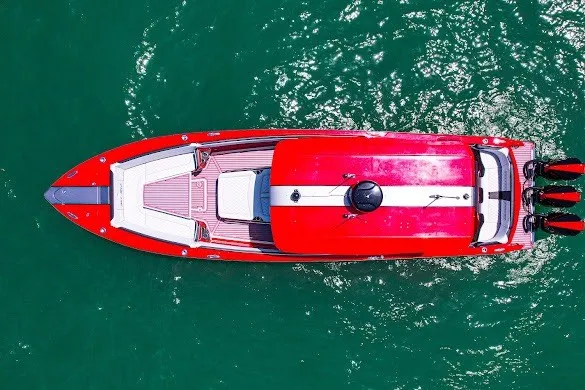 Slide: The Image of Aerial view of 2022 Nor-Tech 390 Sport boat on green water. - 16