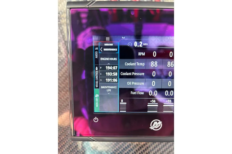Slide: The Image of Dashboard display of a 2022 Nor-Tech 390 Sport showing engine metrics and maintenance data. - 72