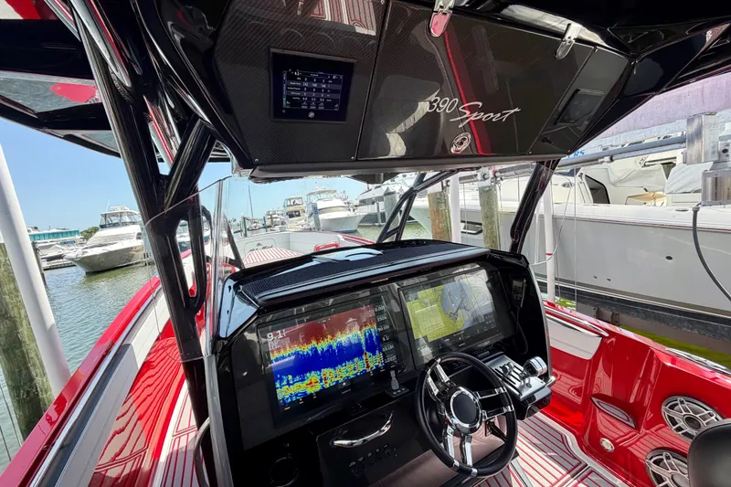Slide: The Image of Interior view of 2022 Nor-Tech 390 Sport boat with advanced navigation system. - 53