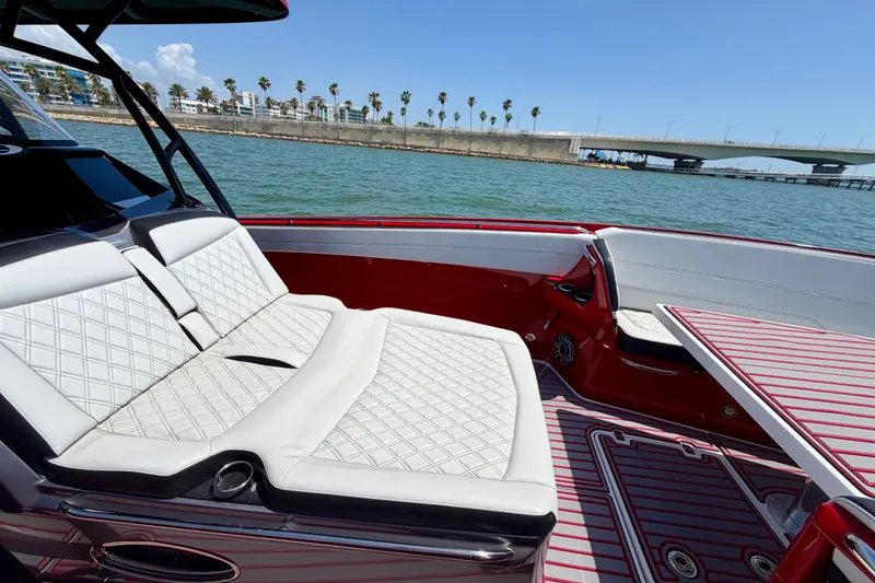 Slide: The Image of Luxurious seating on 2022 Nor-Tech 390 Sport boat, with scenic waterfront view. - 41