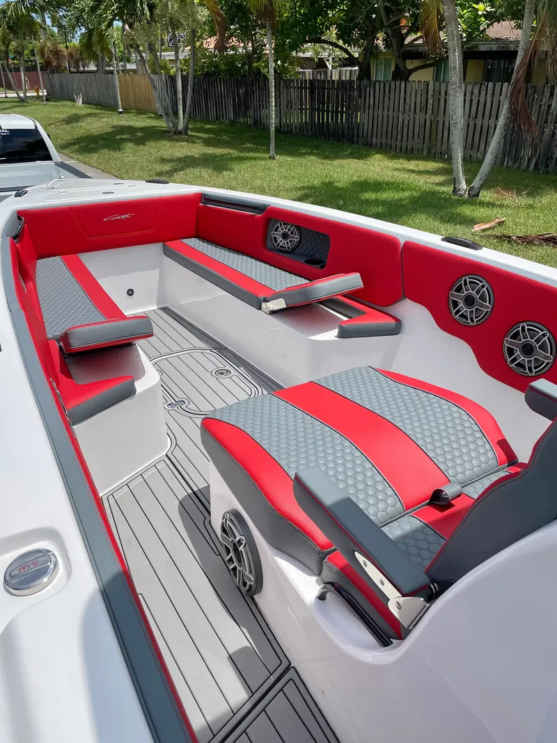 Slide: The Image of The image shows a modern boat interior with red and gray seating and speakers. - 5