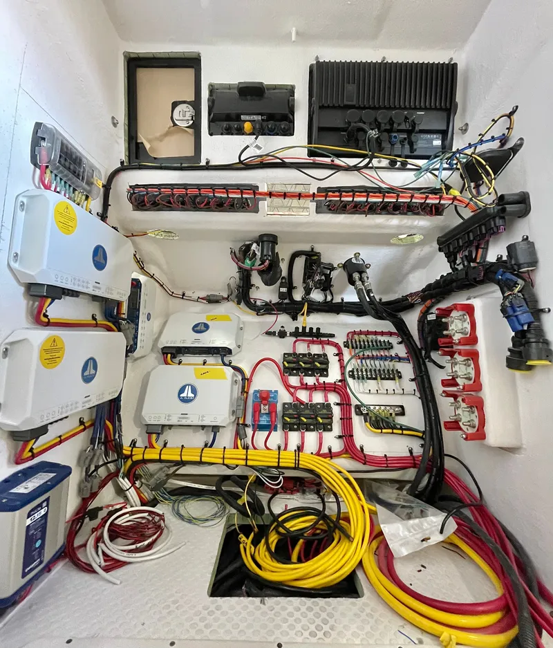 Slide: The Image of A well-organized electrical system in a boat with various cables and devices. - 10