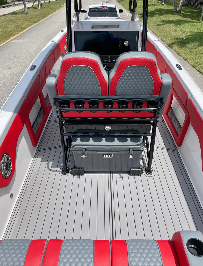 Slide: The Image of The image shows the cockpit of a modern boat with red and gray seating. - 7