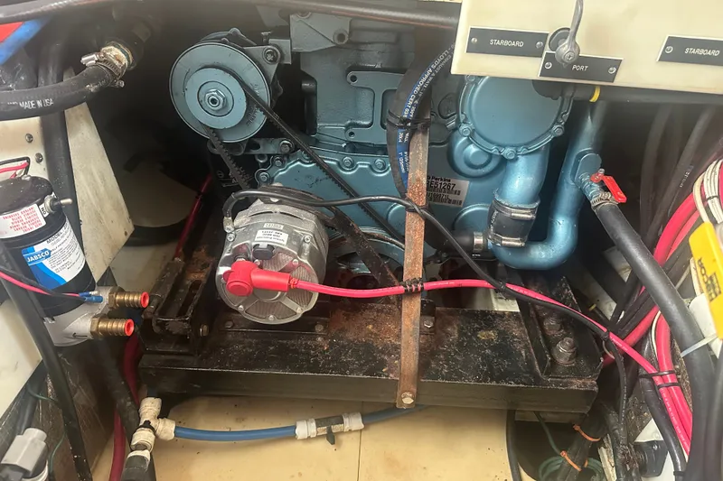 Slide: The Image of Engine compartment of a 1977 Down East Yachts DownEaster 45, showing mechanical components. - 35