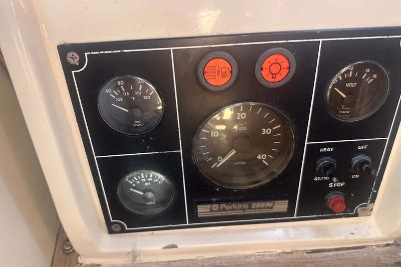 Slide: The Image of Instrument panel of a 1977 Down East Yachts DownEaster 45 with gauges and switches. - 33