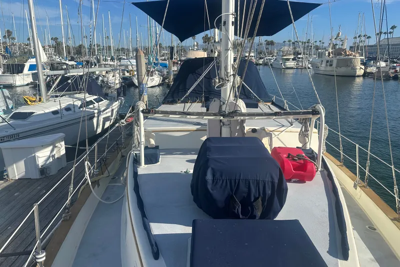 Slide: The Image of 1977 Down East Yachts DownEaster 45 sailboat docked in a marina, sunny day. - 10