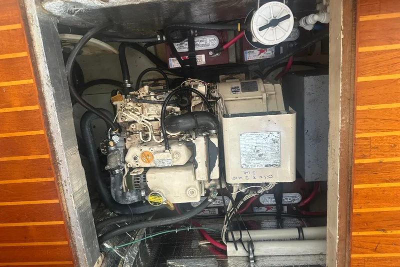 Slide: The Image of Engine compartment of a 1977 Down East Yachts DownEaster 45, showcasing mechanical components. - 34