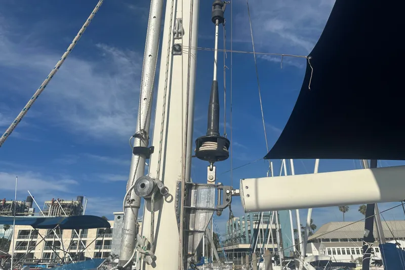 Slide: The Image of Mast and rigging of a 1977 Down East Yachts DownEaster 45 sailboat under blue sky. - 12