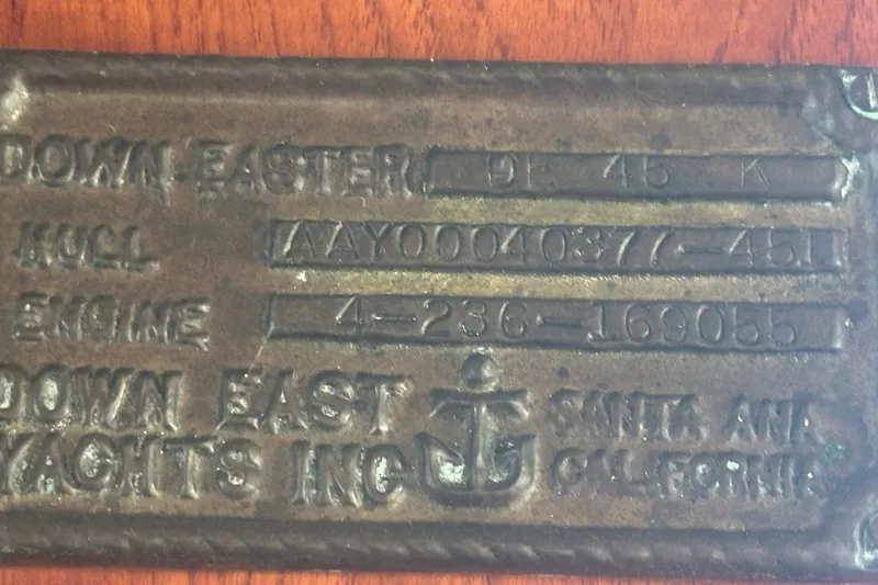 Slide: The Image of Metal identification plate for 1977 Down East Yachts DownEaster 45, displaying hull and engine details. - 36